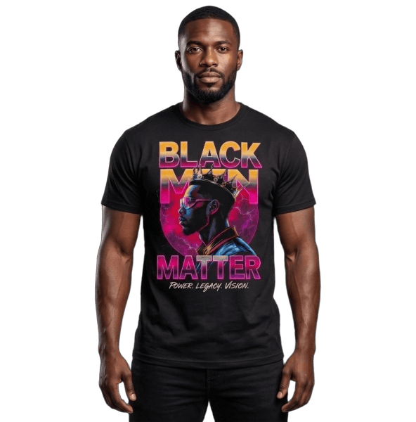 Studio mockup of a muscular Black man modeling a premium black heavyweight t-shirt against a transparent background. The shirt features a vibrant graphic with a crowned Black king in profile wearing sunglasses, surrounded by pink, purple, and blue gradient text that reads "BLACK MEN MATTER" and "POWER. LEGACY. VISION." below.